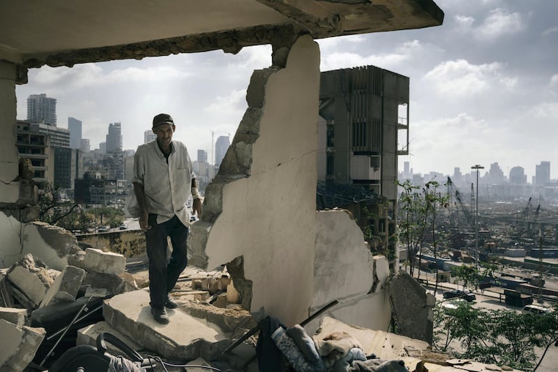 BEIRUT, LEBANON - AUGUST 14:
Abdullah walks in the ruins of his former house.
Since the day of the explosion he is squatting in the damaged building were he once lived with his family, with no water or electricity.
An estimated 300,000 people lost their homes in after the blast.
(Photo by Lorenzo Tugnoli/ Contrasto for The Washington Post)