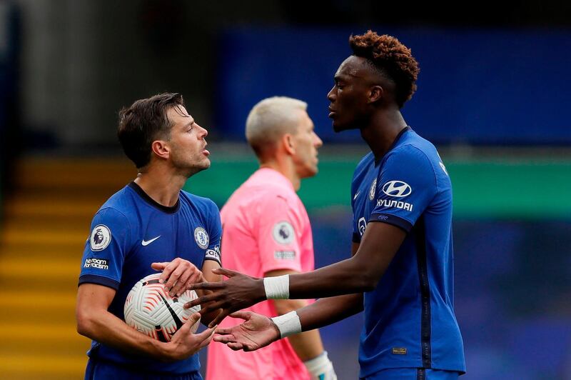 Cesar Azpilicueta tells Tammy Abraham that the striker will not be taking the penalty that resulted in Chelsea's fourth goal. AFP