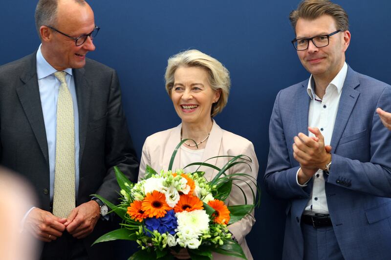 European Commission President Ursula von der Leyen, with Christian Democratic Union leader Friedrich Merz, left, and CDU member Daniel Caspary in Berlin on Monday. Reuters
