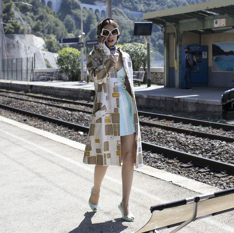 Like a modern day Grace Kelly, Emily in a vintage Courreges dress under a patterned, vintage trench.