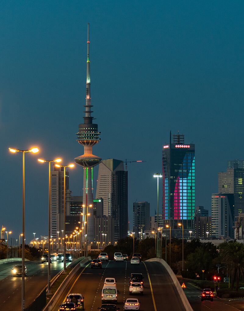 Buildings lit up in the colours of Kuwait.