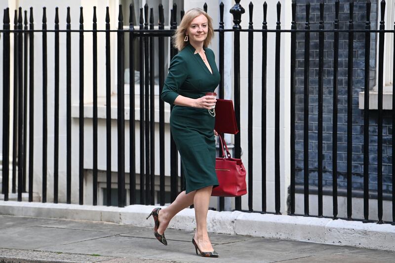 Britain's new Foreign Secretary Liz Truss walks along Downing street before the Cabinet meeting. AFP