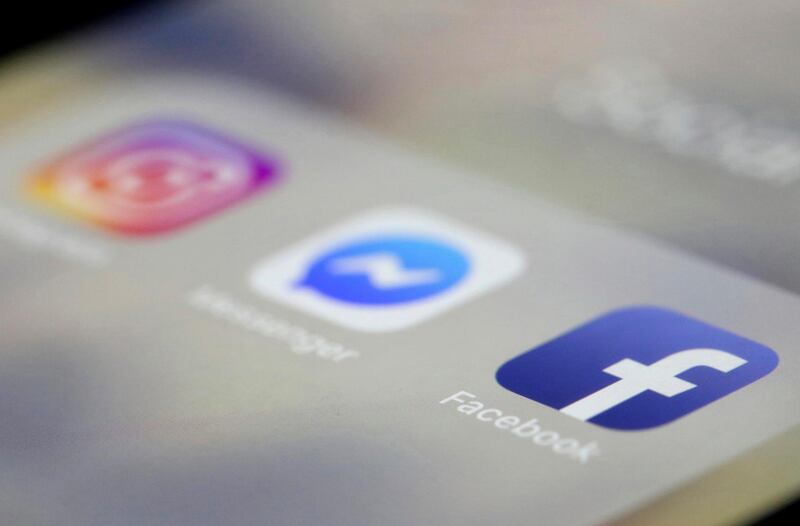 FILE- In this March 13, 2019, file photo Facebook, Messenger and Instagram apps are are displayed on an iPhone in New York. Facebook, Instagram and WhatsApp were temporarily down early Sunday, April 14. All three social media platforms, including Facebook Messenger, were affected by the outage. (AP Photo/Jenny Kane, File)