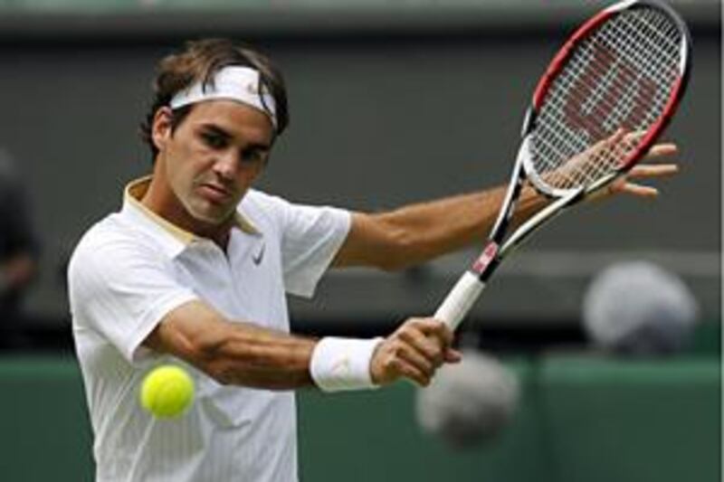 The world No 2 Roger Federer dropped his first set of these championships against Philipp Kohlschreiber but still overcame the German three sets to one.