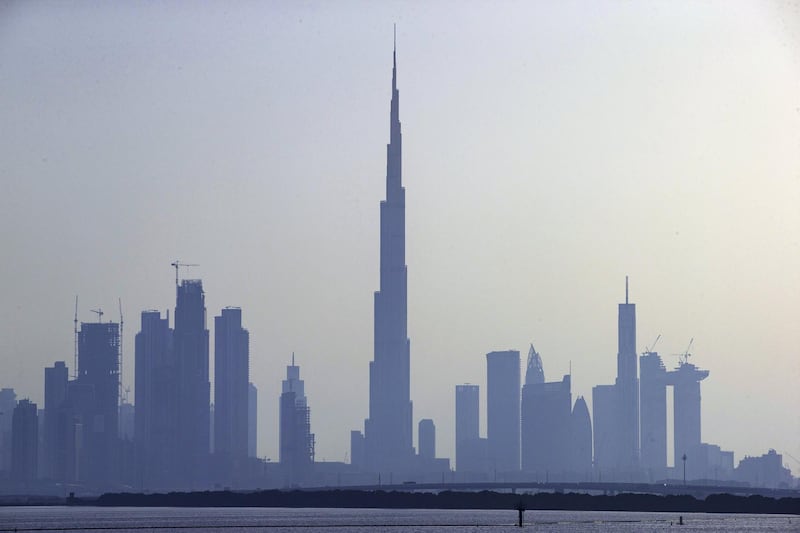 The Burj Khalifa skyscraper, center, stands above other skyscrapers on the city skyline in Dubai, United Arab Emirates. Photographer: Christopher Pike/Bloomberg