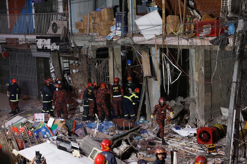 Firefighters and rescue workers at the site of an explosion in an office building in Dhaka, Bangladesh, on Tuesday. Reuters