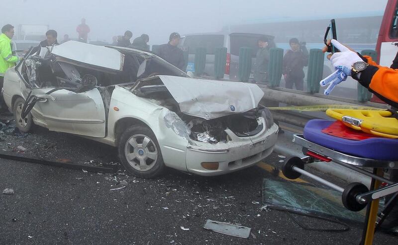 Kim Seong-Han, an official from the Incheon Seobu Police Station, said emergency workers have yet to reach all of the damaged cars on the 4,400-metre cross-sea bridge on the motorway from the airport to the capital Seoul. James Park / EPA