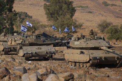 Israeli Merkava tanks were positioned in the upper Galilee in northern Israel near the border with Lebanon on October 11.  AFP