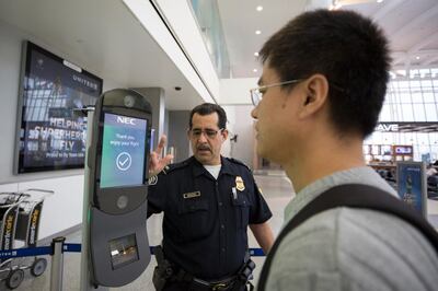 U.S. Customs and Border Protection, Office of Field Operations, officers take biometric photos of passengers prior to boarding a flight at Houston International Airport on February 12, 2018. 

Photographer: Donna Burton