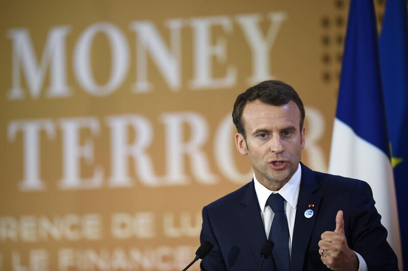 French President Emmanuel Macron gives a speech during the first day of a two-day conference on combating the financing of terror groups on April 26, 2018 at the Organisation for Economic Co-operation and Development (OECD) in Paris, bringing together around 80 ministers and 500 experts.
French authorities have identified 416 people who gave money to the Islamic State (IS) group, France's top anti-terror prosecutor said on April 26.  / AFP PHOTO / POOL / Eric FEFERBERG