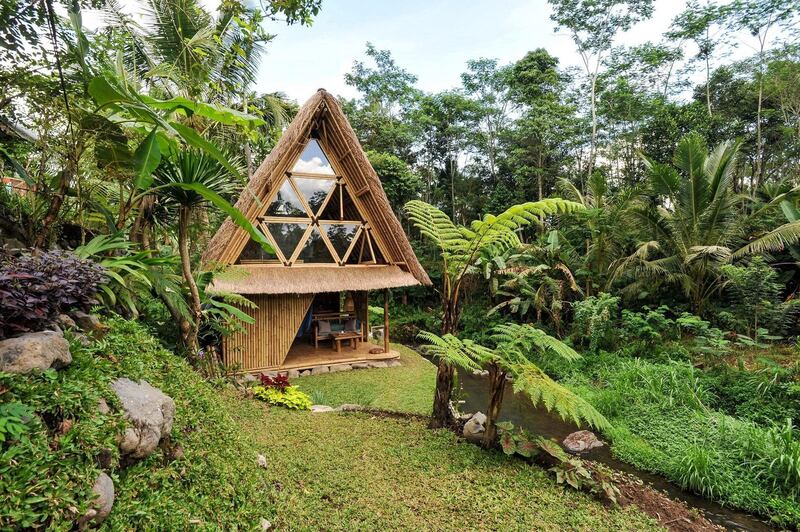 4. Another bamboo home in Bali, The Hideout, provides an eco stay along a river n the mountains of the Gunung Agung volcano.