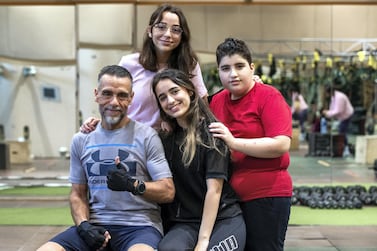 Ihsan Sakka at Abu Dhabi Country Club with his children, from left to right, Huda, 16, Nur, 20 and Abdulvahab, 14. Victor Besa / The National