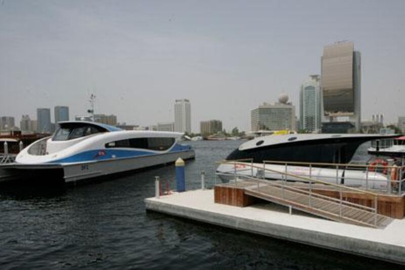 A water taxi, left, is moored next to a Dubai ferry at the Creek’s Al Seef terminal.