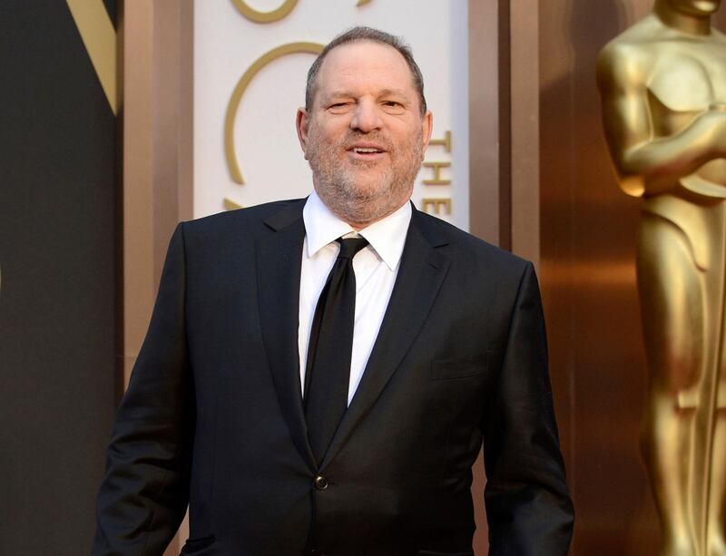 FILE - In this March 2, 2014 file photo, Harvey Weinstein arrives at the Oscars in Los Angeles. Day by day, the accusations pile up, as scores of women come forward to say they were victims of Weinstein. But others with stories to tell have not. For some of these women whoâ€™ve chosen not to go public, the fear of being associated forever with the sordid scandal _ and the effects on their careers, and their lives _ might be too great. Or they may still be struggling with the lingering effects of their encounters. (Photo by Jordan Strauss/Invision/AP, File)