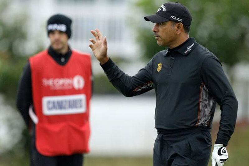 Jeev Milkha Singh reacts to the crowd after putting on the second at Royal Lytham