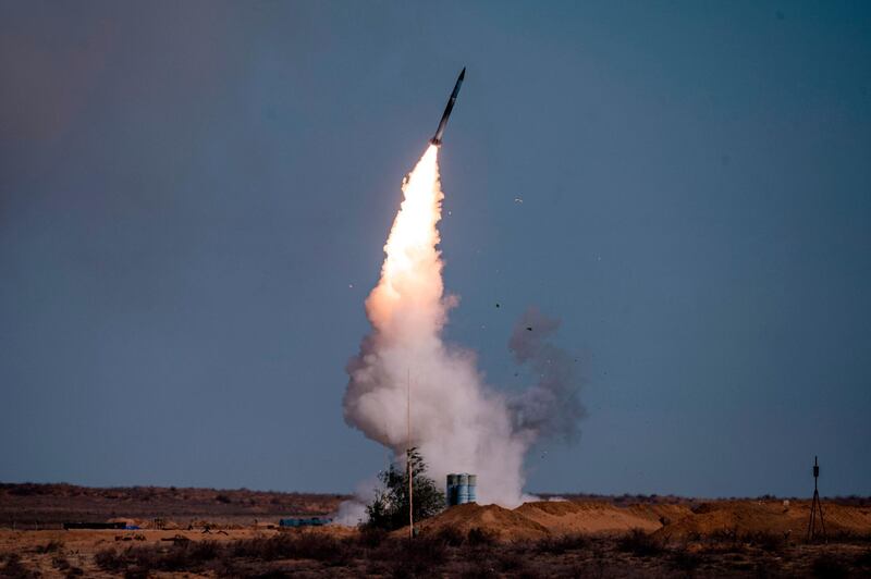 (FILES) In this file photo taken on September 22, 2020 A rocket launches from a S-400 missile system at the Ashuluk military base in Southern Russia during the "Caucasus-2020" military drills gathering China, Iran, Pakistan and Myanmar troops, along with ex-Soviet Armenia, Azerbaijan and Belarus. The United States on December 14, 2020 imposed sanctions on Turkey's military procurement agency after the NATO ally defiantly bought Russia's S-400 air defense system. / AFP / Dimitar DILKOFF
