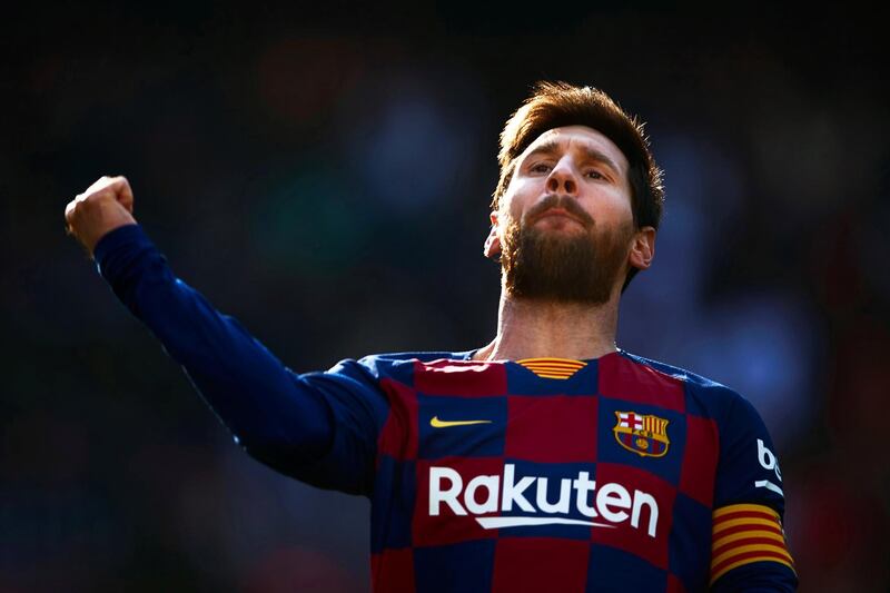 Lionel Messi celebrates after scoring the first of his three-first-half goals against Eibar. EPA