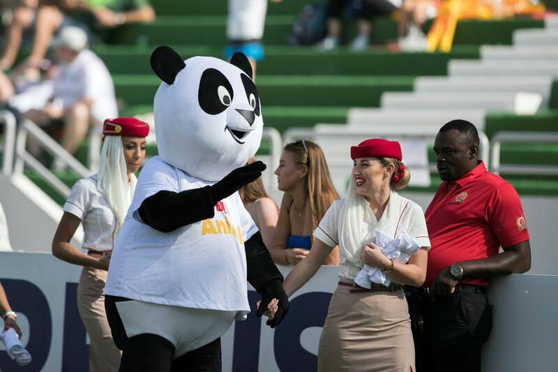 DUBAI, UNITED ARAB EMIRATES - DECEMBER 1, 2018. 

Emirates mascots give away freebies on the final day of this year's Dubai Rugby Sevens.

(Photo by Reem Mohammed/The National)

Reporter: 
Section:  NA  SP