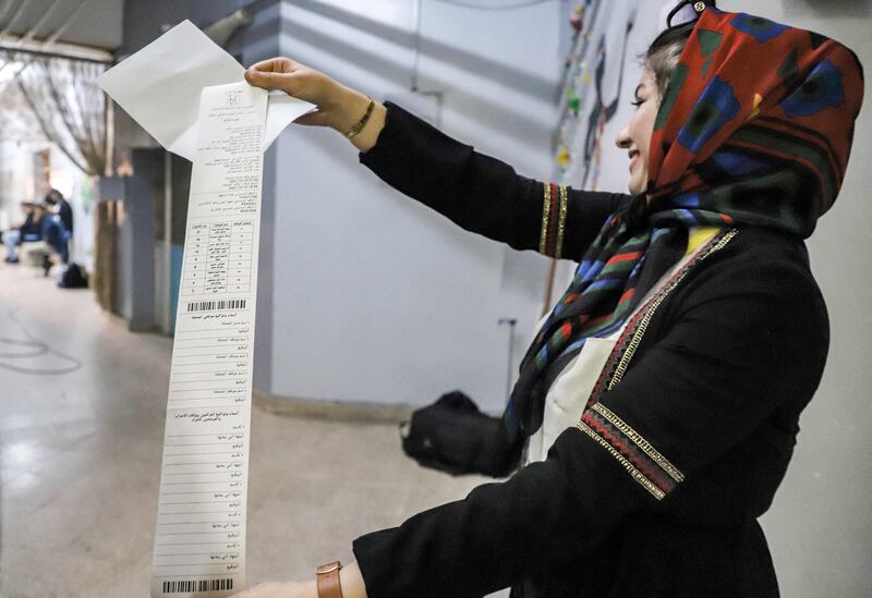 An Iraqi election official holds a printout of the electronic count of votes at a polling station in the north-eastern city of Sulaymaniyah in Iraq's autonomous Kurdistan region. AFP