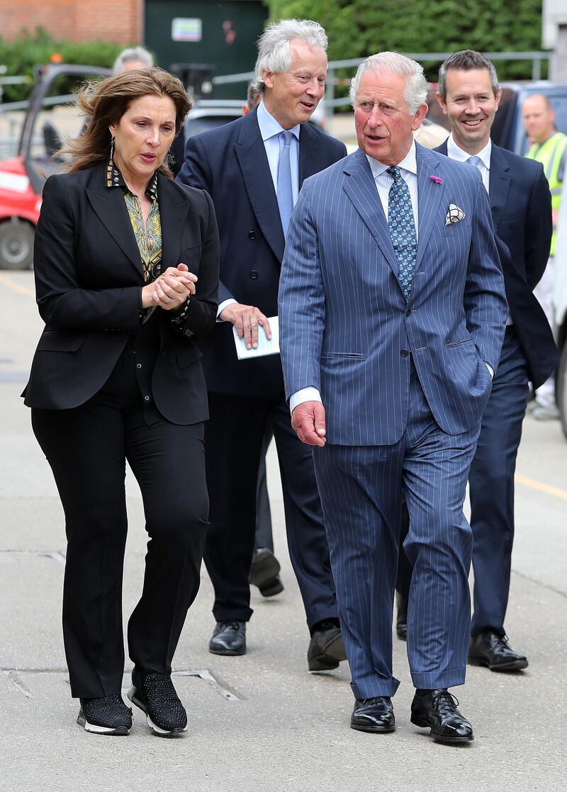 Producer Barbara Broccoli shows Prince Charles onto the set at Pinewood Studios. Getty Images