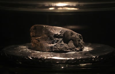 A fragment of the Winchcombe meteorite on display at the Natural History Museum in London. Getty Images