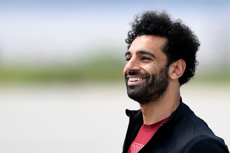 Liverpool's Mohamed Salah walks to the plane at the John Lennon Airport on Friday. AFP