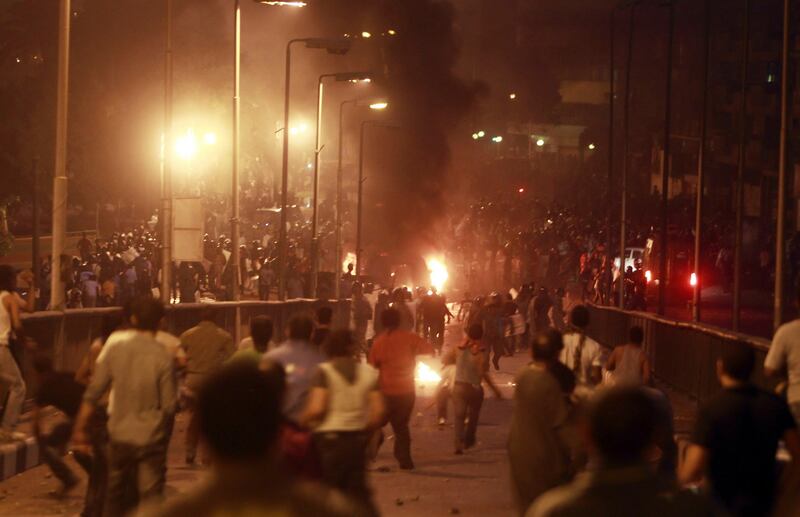 Egyptian Christians clash with soldiers and riot police during a protest against an attack on a church in southern Egypt, in Cairo October 9, 2011. Nineteen people were killed in Cairo on Sunday when Christians, some carrying crosses and pictures of Jesus, clashed with military police, medical and security sources said, in the latest sectarian flare-up in a country in political turmoil. REUTERS/Amr Abdallah Dalsh (EGYPT - Tags: CIVIL UNREST POLITICS RELIGION) *** Local Caption ***  AMR15_EGYPT-COPTS-C_1009_11.JPG