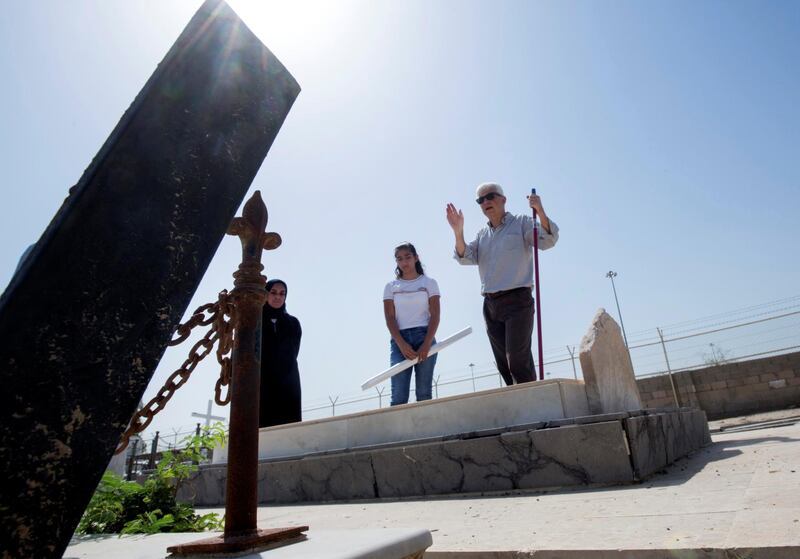 ABU DHABI, UNITED ARAB EMIRATES - Prof. Athol Yates of Khalifa University with his team in one of the tomb to check the name at Sas Al Nakhel Cemetery, Non Muslim.  Ruel Pableo for The National for John Dennehy's story