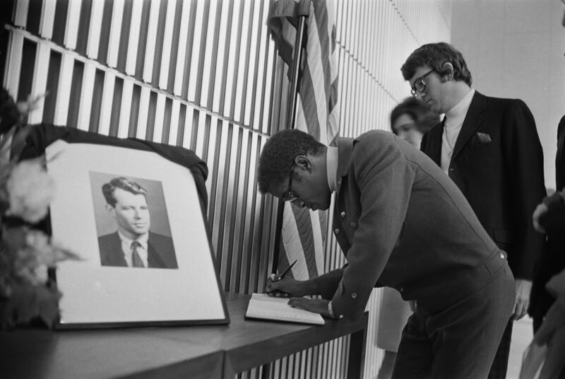 American actor, dancer and singer Sammy Davis Jr signs the book of condolences for Senator Robert Kennedy at the embassy in 1968. Getty Images
