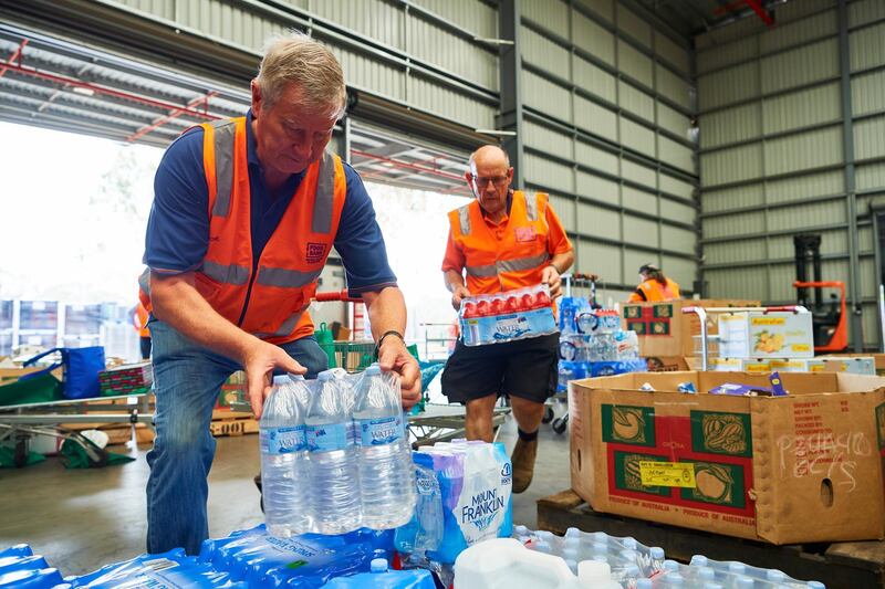 Volunteers help help organise large donations of goods at the Food Bank Distribution Centre bound for areas impacted by bushfires in the Glendenning suburb of Sydney, Australia. Getty Images