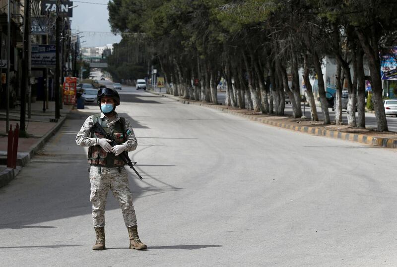 A Jordanian soldier stands guard at a checkpoint in the northern governorate of Irbid. Reuters
