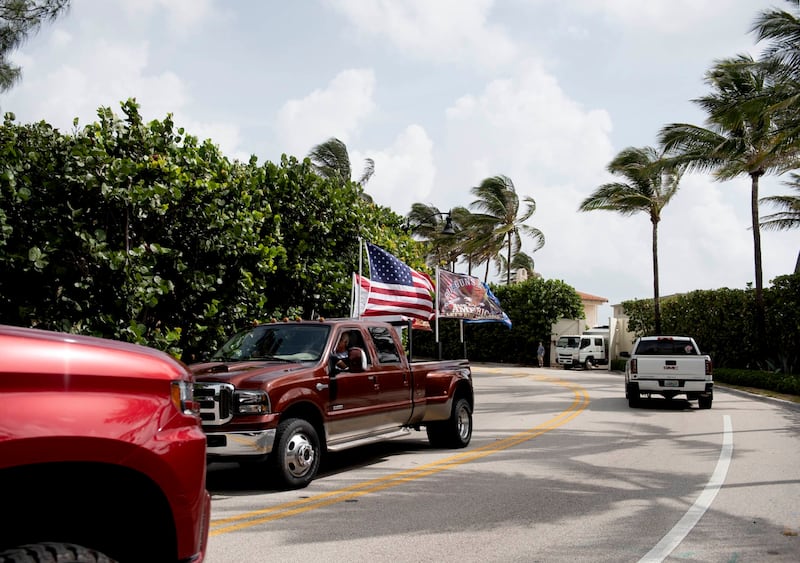 Trump supporters, members of the media and law enforcement gather near Mar-a-Lago. The Palm Beach Post / AP