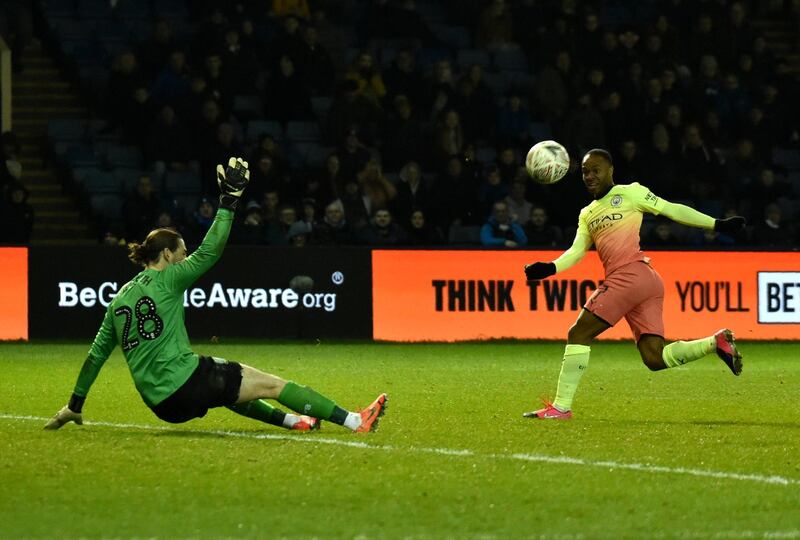 Sheffield Wednesday goalkeeper Joe Wildsmith saves from Manchester City's Raheem Sterling. AP