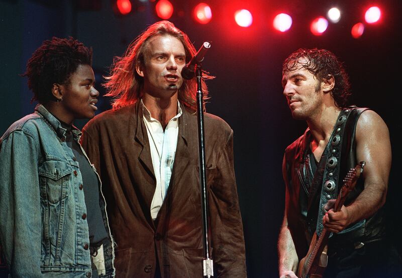 Tracy Chapman, Sting and Bruce Springsteen perform at the Amnesty International benefit concert at JFK Stadium in Philadelphia, Pennsylvania on September 19, 1988. AFP