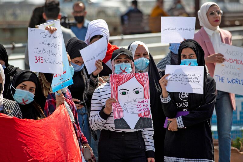 Demonstrators wearing cross-out masks attend a rally for International Women's Day in the southern Iraqi city of Basra. Photo: AFP