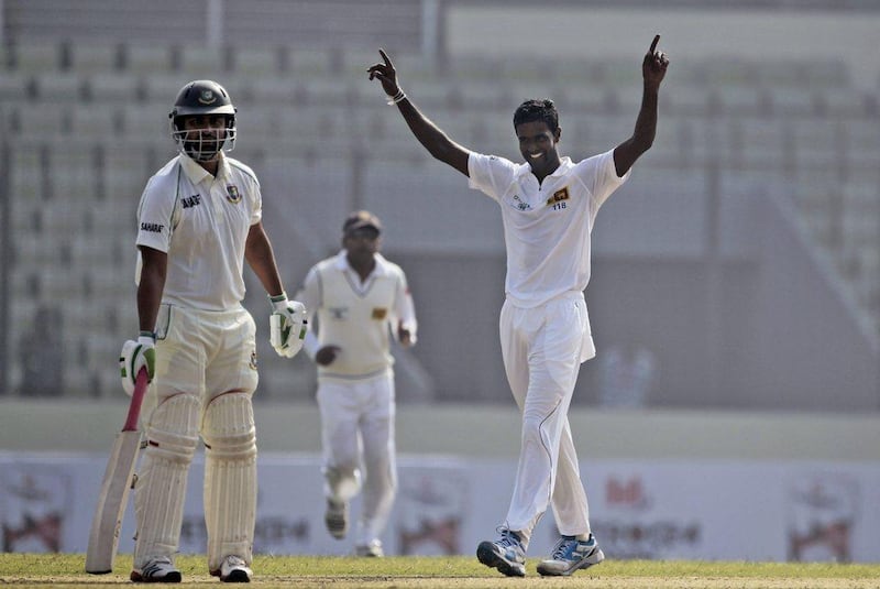 Shaminda Eranga took four wickets against Bangladesh on Monday as Sri Lanka bowled out the hosts for 232. AM Ahad / AP