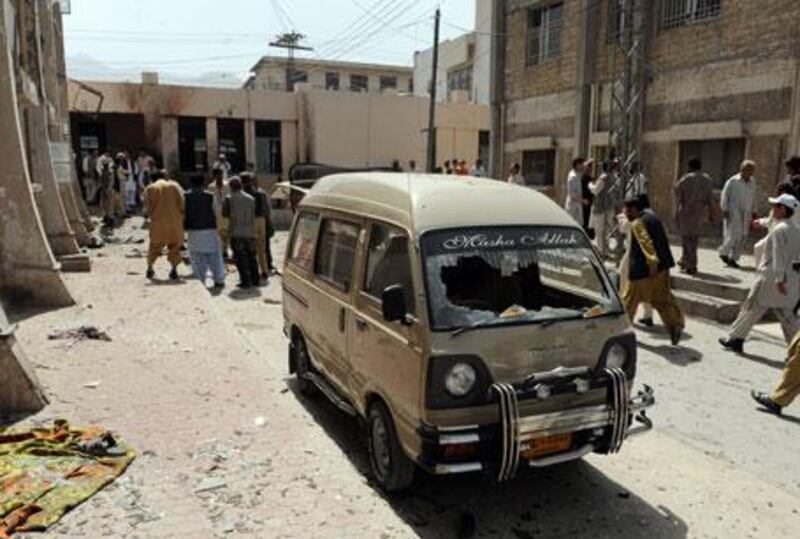 A damaged vehicle is seen at the site of a bomb blast on the premises of a hospital in Quetta on Friday, April 16, 2010.