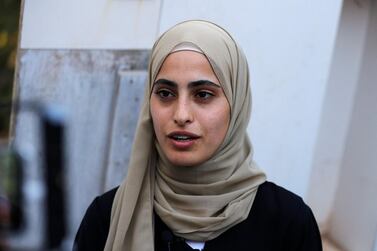 Muna El Kurd, 23, talks to reporters at home after being released on Sunday. AFP