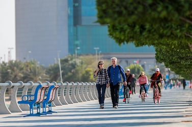 Residents take a walk on Abu Dhabi Corniche. Expatriates have been called upon to ill out a questionnaire designed by the Department of Community Development. Vicor Besa / The National