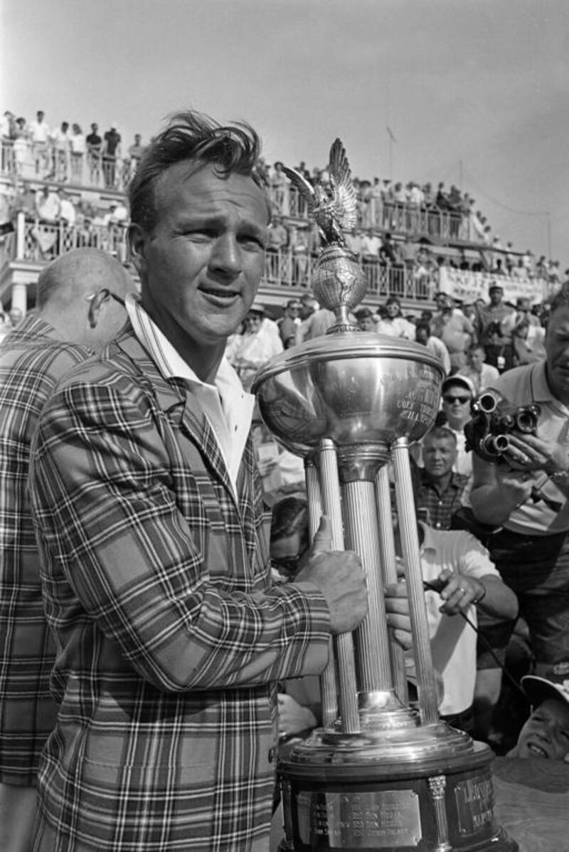 This May 14, 1962, file photo shows Arnold Palmer holding the trophy cup after he defeated Johnny Pott, 69-73, in an 180-hole play-off match at the Colonial National Invitation golf tournament at Fort Worth, Texas. AP Photo