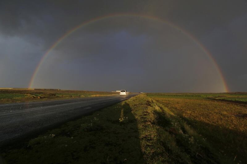 epa07773607 A rainbow shines in the sky during rain on the outskirts of Sanaâ€™a, Yemen, 14 August 2019.  EPA/YAHYA ARHAB