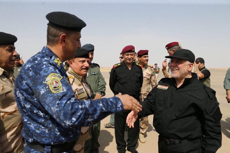 Iraqi Prime Minister Haider al-Abadi (R) is pictured in Mosul Iraq, July 9, 2017. Iraqi Prime Minister Media Office/Handout via REUTERS ATTENTION EDITORS - THIS IMAGE WAS PROVIDED BY A THIRD PARTY. NO RESALES. NO ARCHIVES. TPX IMAGES OF THE DAY