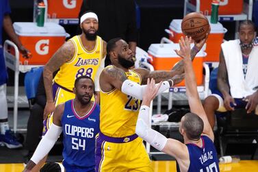 Los Angeles Lakers forward LeBron James (23) shoots against LA Clippers forward Patrick Patterson (54) and centre Ivica Zubac (40).USA Today