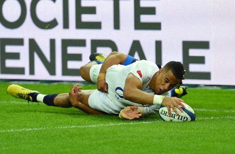 Anthony Watson of England scores his team’s third try despite the tackled from Wesley Fofana of France during the RBS Six Nations match between France and England at the Stade de France on March 19, 2016 in Paris, France. (Photo by Shaun Botterill/Getty Images)