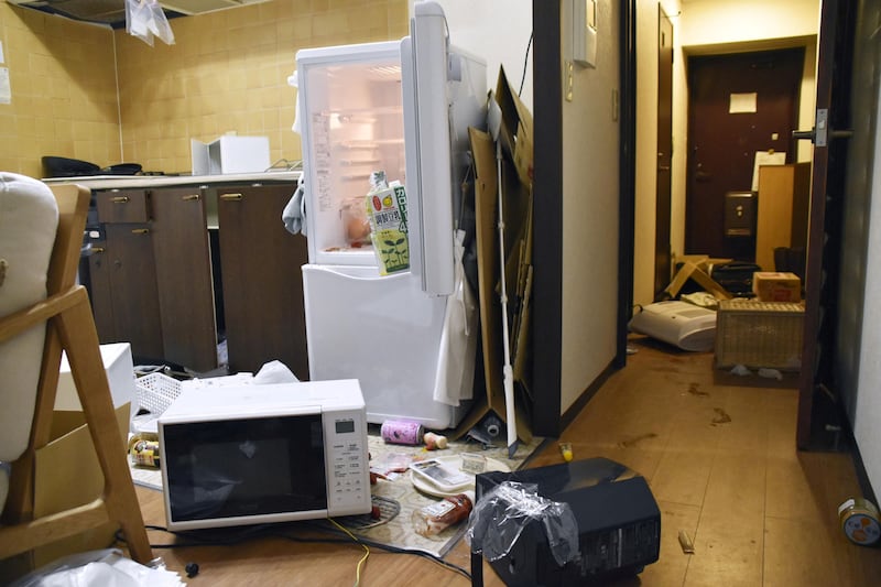 Furniture and electrical appliances are scattered about an apartment in Fukushima. Reuters
