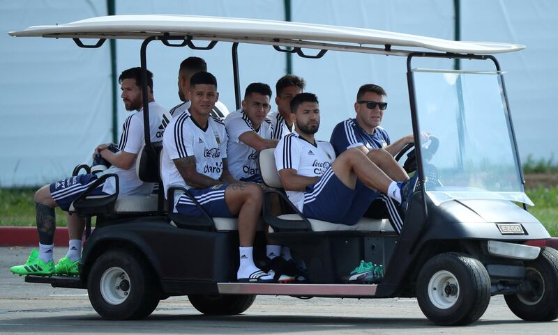 Argentina's Lionel Messi and team mates arrive for a training session on June 25. Albert Gea / Reuters