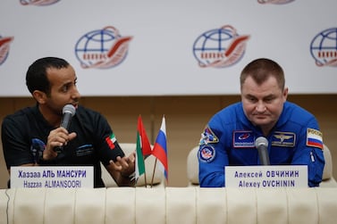 Emirati astronaut Hazza Al Mansouri and Russian cosmonaut Alexey Ovchinin attend a news conference at the Gagarin Cosmonaut Training Centre in Star City outside Moscow, Russia, on Wednesday. Yuri Kochetkov / EPA