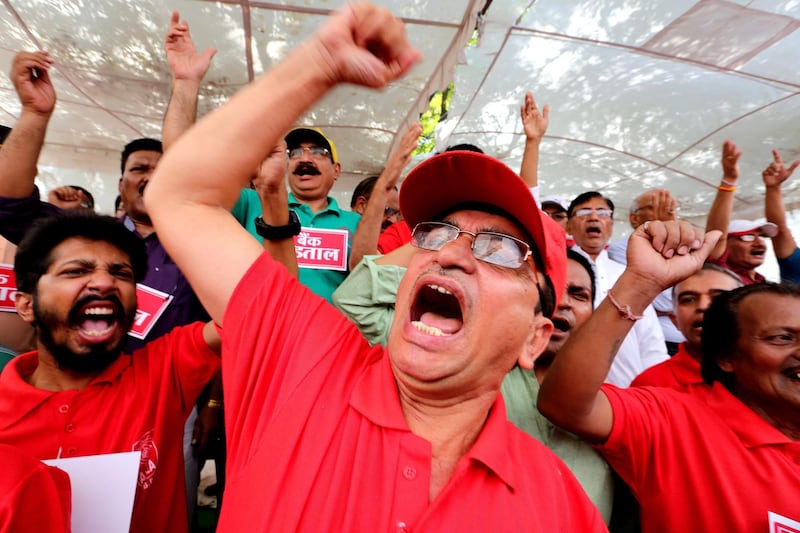 Indian bank employees shout slogans as they take part in a protest during the nationwide strike call given by the United Forum of Bank Unions (UFBU) in Bhopal, India. Sanjeev Gupta / EPA