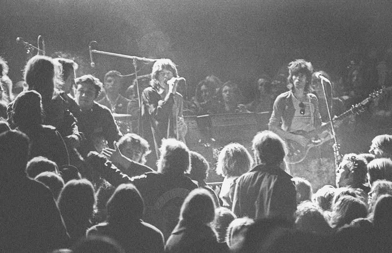 LIVERMORE, CA - DECEMBER 6: Mick Jagger and Keith Richards of the Rolling Stones warily eye the Hells Angels onstage at The Altamont Speedway on December 6, 1969 in Livermore, California. (Photo by Robert Altman/Michael Ochs Archives/Getty Images) *** Local Caption *** Mick Jagger;Keith Richards