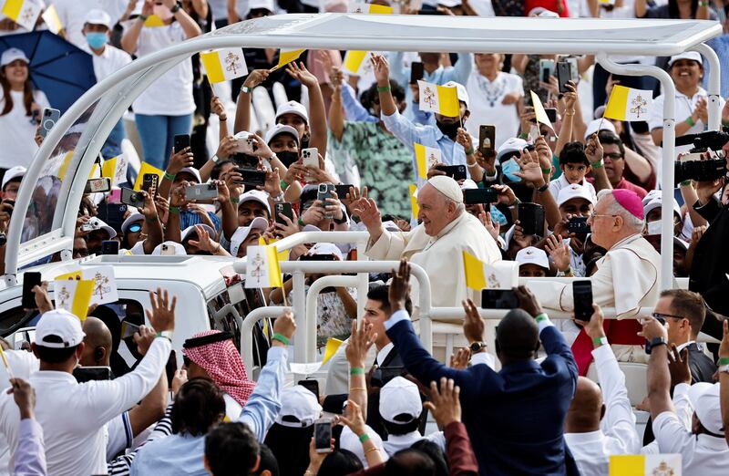 Pope Francis greets people. Reuters / Hamad I Mohammed